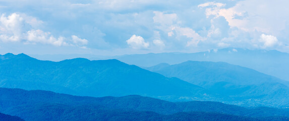 Landscape of mountains range with morning frog for mountain background.