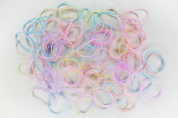 Pile of many color rubber bands isolated on white background
