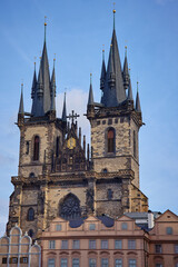 Fototapeta premium View of Gothic Church of Our Lady before Tyn with two tall spires and historic buildings in Old Town Square of Prague, Czech Republic. Concept of travel and European architecture