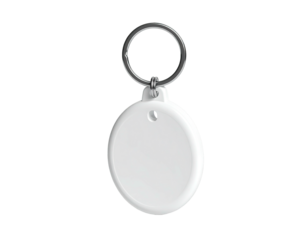White, round key fob with a metal ring against a black background