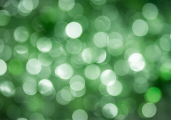 Obraz premium Abstract Blurred Green and White Bokeh Lights Background Texture