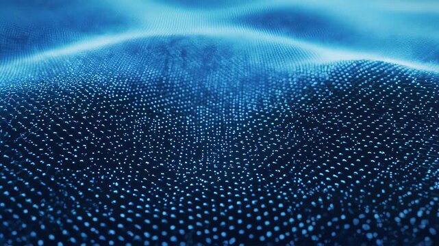 A deep, blurred blue image of many spherical lights, with a field of dots forming wave-like shapes