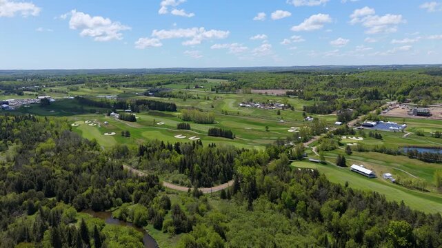 A wide aerial view of the TPC Toronto at Osprey Valley during the PGA RBC Canadian Open. The drone captures the championship course set up with tents and infrastructure for the event.