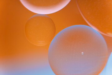 Abstract Orange and Blue Gradient with Oil Bubbles in Water