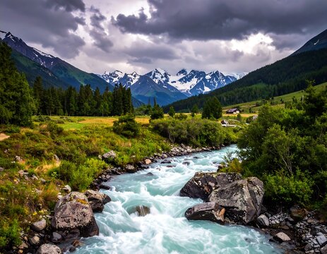 Rushing turquoise river flows through verdant valley toward snow-capped mountains under a dramatic, cloudy sky