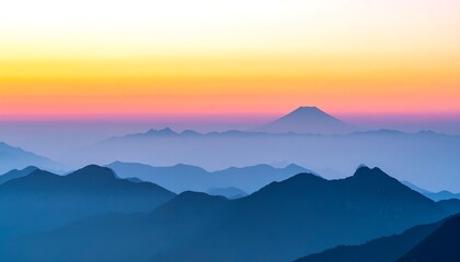 Misty Mountain Range at Sunrise - A Serene Landscape.