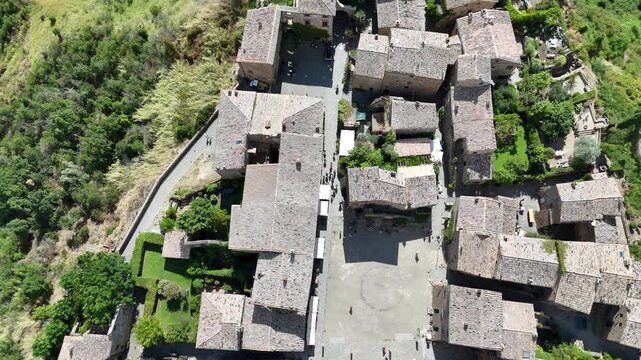 Aerial drone footage of Civita di Bagnoregio, the famous &lsquo;dying town&rsquo; in Lazio, perched on a hilltop with dramatic surrounding valleys.