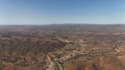 Brachina Gorge, South Australia – Aerial Drone Image of Geological Trail, Rugged Red Cliffs, Winding Dirt Road, Vast Valleys, Mountain Ridges, Rocky Terrain, Outback Landscape in Flinders Ranges