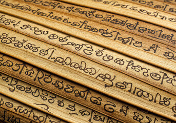 Textured view of an old palm leaf manuscript with ancient Indian script, representing timeless wisdom and traditional knowledge preservation.