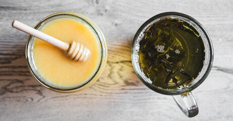 Creamed Honey and Herbal Tea Side by Side – Overhead Composition