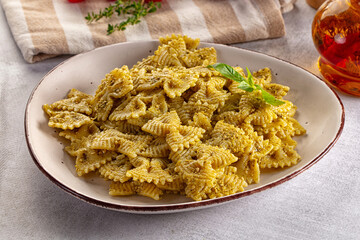 Italian green pasta farfalle with pesto