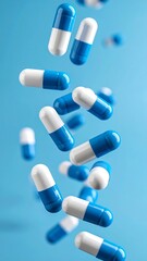 Pharmaceutical capsules in motion against a vibrant blue backdrop