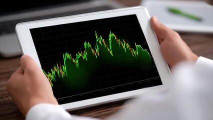Stock market chart tablet device financial graph investment analysis business data digital screen trading concept green line graph technology hands holding tablet market trend business finance person - Powered by Adobe