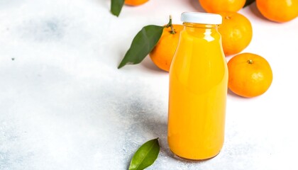 Freshly Squeezed Orange Juice in a Glass Bottle with Oranges.