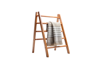 Wooden ladder display rack with a striped blanket on white background