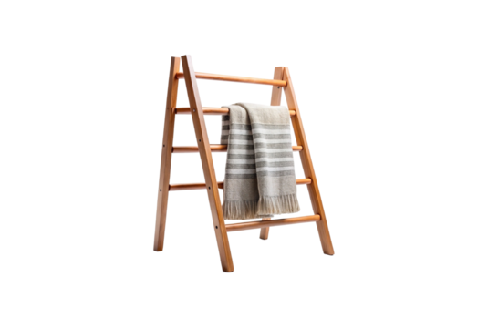 Wooden ladder display rack with a striped blanket on white background