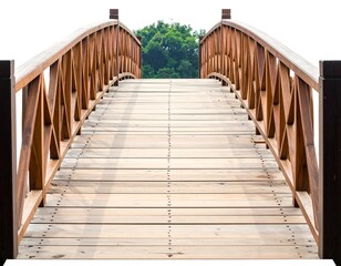 Fototapeta premium Wooden bridge with a lattice railing curves upwards towards lush green foliage against a bright background