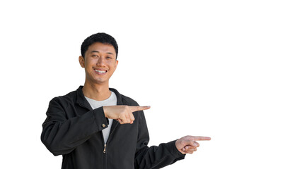A young Asian man in his 20s wearing black coat happy smiling pointing thumbs up isolated on a white background. The person's index finger pointing to a blank space for text