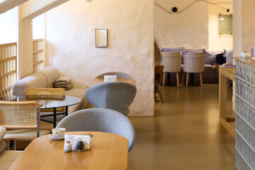 The modern cafe interior has a sleek design that creates a cozy and inviting atmosphere