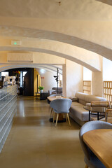 The modern restaurant boasts a stylish, inviting interior with comfortable seating for dining