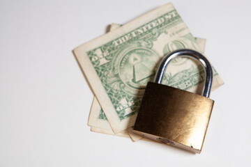 Padlock and money on a white background. Money security concept.
