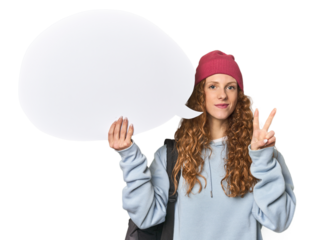 Redhead holding a comic speech bubble showing number two with fingers.
