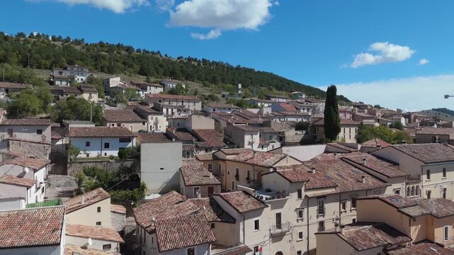 Aerial drone footage of Barisciano, Abruzzo, featuring historic stone houses, narrow streets, and surrounding mountain scenery