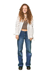 Obraz premium Full-body redhead portrait laughs and closes eyes, feels relaxed and happy.