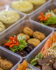 Packed meal boxes containing marinated glossy eggs, fried snacks, vermicelli noodles, bean sprouts, tomato and lime slices — ideal for catering, meal-prep services, menus and food delivery marketing