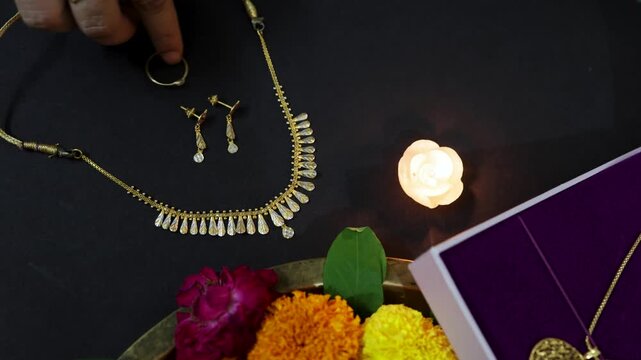 Ritual worship composition combining gold items and oil lamp for holy celebration