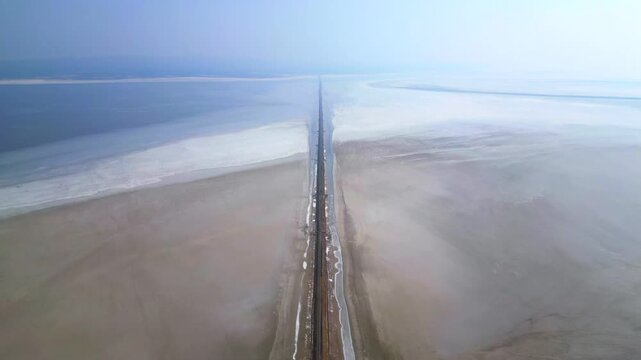 Aerial view of the Road to Heaven, Dholavira, stretching across the White Rann of Kutch, India, Stunning desert landscape with endless salt flats and a serene sky,  Road to heaven, Rann of Kutch