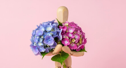 Wooden mannequin holds two colorful hydrangea flower bouquets contrasting colors
