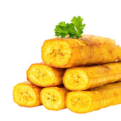 Close-up of stacked, fried plantain slices with a sprig of greenery against a black background