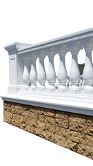 White balustrade with decorative pillars atop a textured stone wall. Perspective
