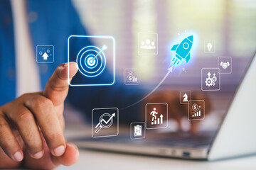 Business growth to target. Startup new project. Rocket launching from laptop to business icon. Represent strategic planning, Goal setting. Investment management. Company strategy. Business vision