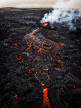 Dramatic volcanic eruption with glowing lava at Sundhn�kag�gar Iceland
