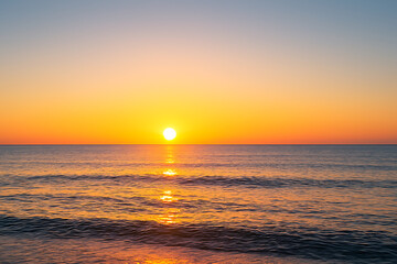 Beautiful ocean beach sunrise seascape nature background wallpaper golden hour sunlight horizon scenic view 4k