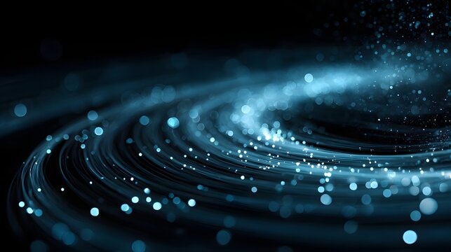 Elegant blue spiral design with glowing particles and blurred lights creating a mesmerizing visual display against a dark backdrop, suggestive of energy, data flow, and futuristic technology or...