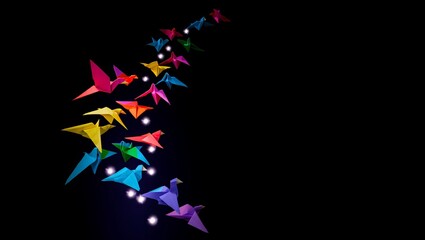 Colorful Origami Cranes Flying in Formation Against a Dark Sky