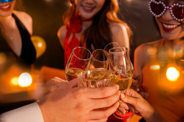  A group of beautiful girls at a company party, drinking, celebrating New Year, club party with friends.