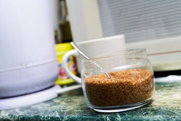 Brown Sugar in Glass Jar on Kitchen Counter with Spoon Close-Up of