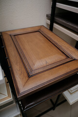 A stack of kitchen cabinet samples in different colors and textures