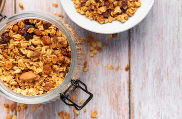Granola cereal in glass jar, healthy breakfast concept