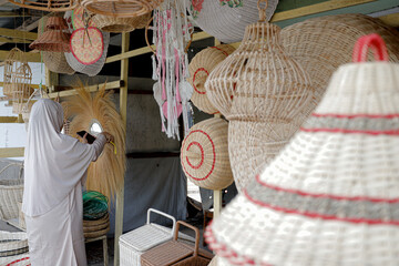 traditional market with goods made from rattan, bamboo and palm leaves.