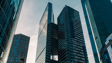 Fototapeta premium mirrored windows of the facade of an office building