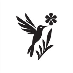 Silhouette of a Hummingbird Approaching a Flower with Extended Wings.