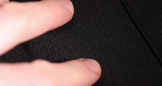 dense black synthetic fabric for clothes and bags, black fabric made of black threads resistant to damage