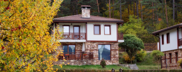 Autumn landscape with trees and houses, Bulgaria