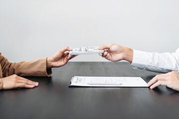 Bribe employer is offer terms to the businessman for signing on contract while making corruption about buy land and real estate