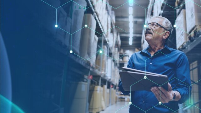 A caucasian warehouse manager checking stock inventory